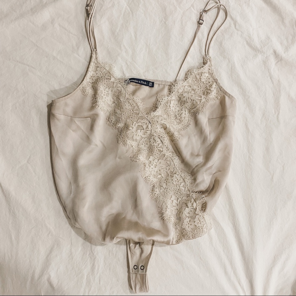 Lightly worn tan cami bodysuit